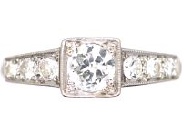 Early 20th Century Platinum Solitaire Diamond Ring with Diamond Set Shoulders