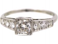 Early 20th Century Platinum Solitaire Diamond Ring with Diamond Set Shoulders