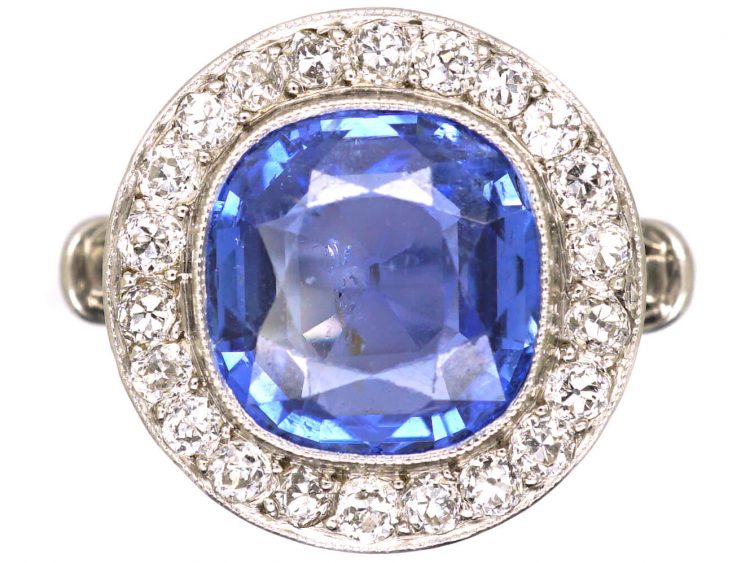 Early 20th Century French Import Platinum Cluster Ring set with a Sapphire & Diamonds