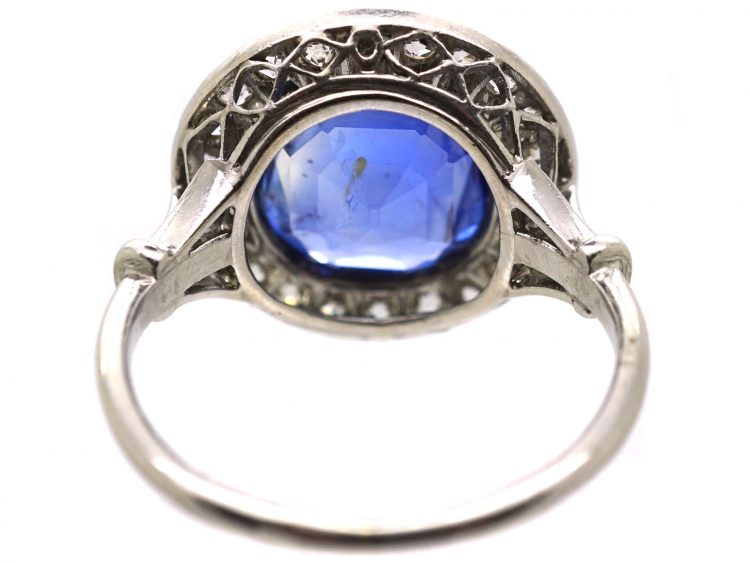 Early 20th Century French Import Platinum Cluster Ring set with a Sapphire & Diamonds