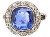 Early 20th Century French Import Platinum Cluster Ring set with a Sapphire & Diamonds