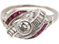 Early 20th Century Platinum Twist Ring set with Diamonds & Rubies