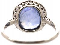 Early 20th Century Platinum Ring set with a Ceylon Sapphire Surrounded by Rose Diamonds