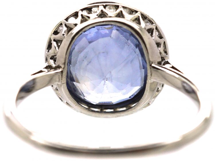 Early 20th Century Platinum Ring set with a Ceylon Sapphire Surrounded by Rose Diamonds