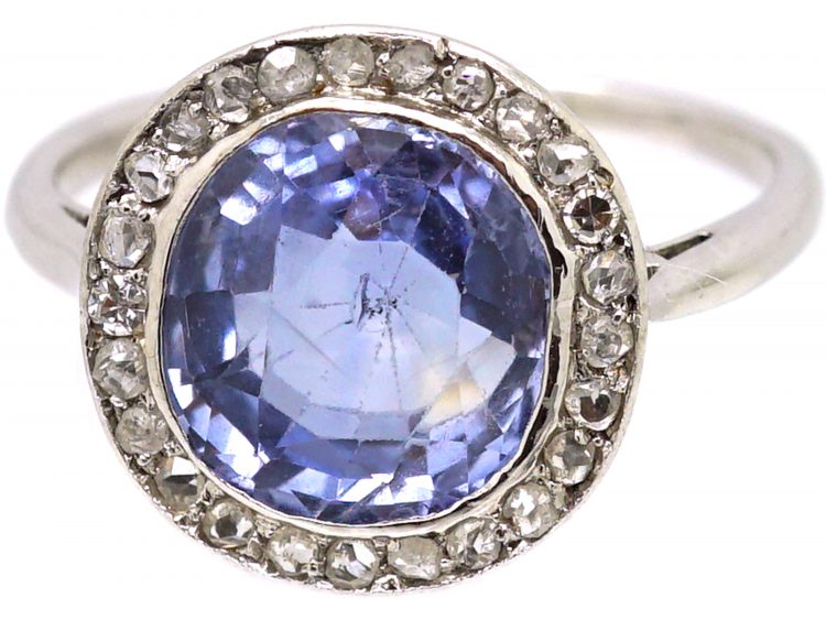 Early 20th Century Platinum Ring set with a Ceylon Sapphire Surrounded by Rose Diamonds