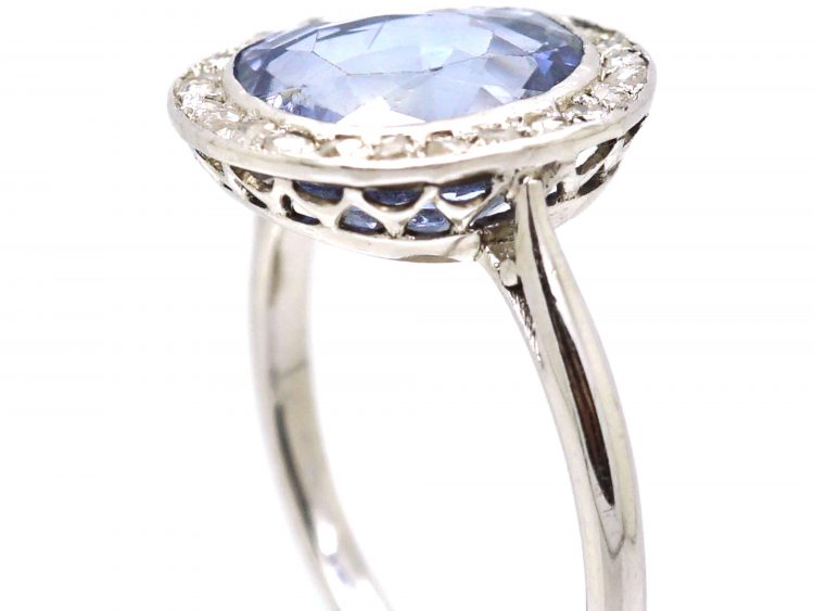 Early 20th Century Platinum Ring set with a Ceylon Sapphire Surrounded by Rose Diamonds