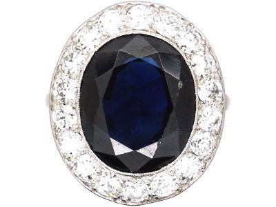 French Import Platinum Cluster Ring set with a Large Sapphire & Diamonds