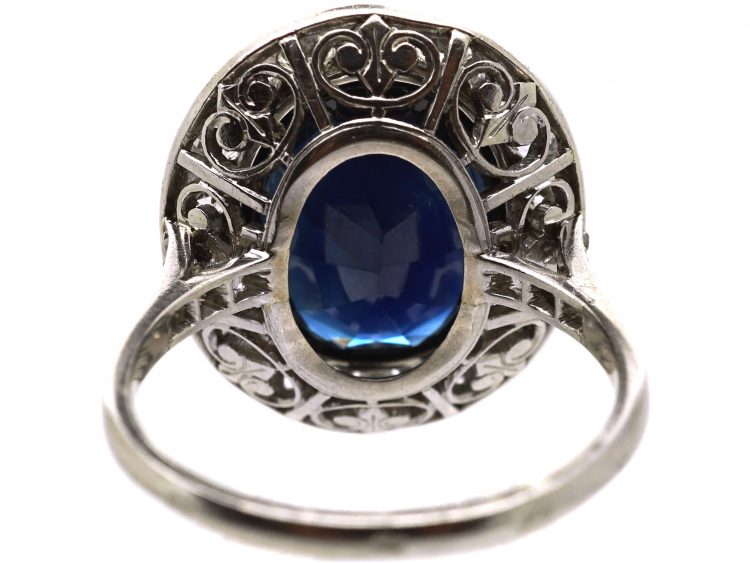 French Import Platinum Cluster Ring set with a Large Sapphire & Diamonds