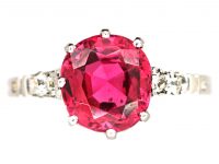 Early 20th Century Platinum, Red Spinel Solitaire Ring with Diamond set Shoulders