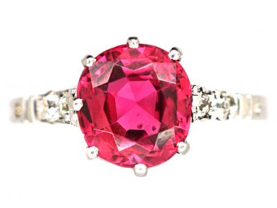 Early 20th Century Platinum, Red Spinel Solitaire Ring with Diamond set Shoulders