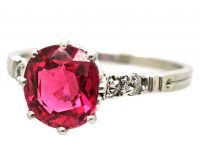 Early 20th Century Platinum, Red Spinel Solitaire Ring with Diamond set Shoulders