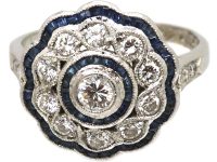 Early 20th Century French Platinum Cluster Target Ring set with Diamonds & Calibre Cut Sapphires