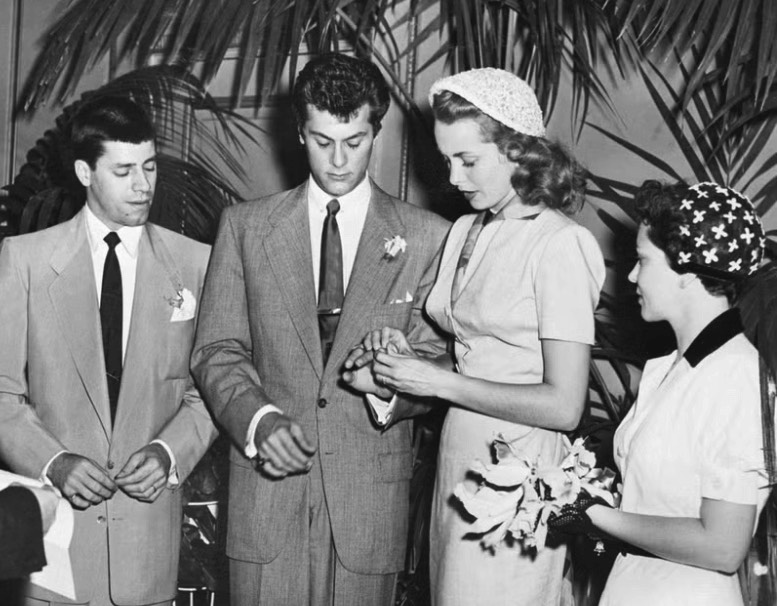 How Much Should You Spend on an Engagement Ring Tony Curtis and Janet Leigh exchanging rings