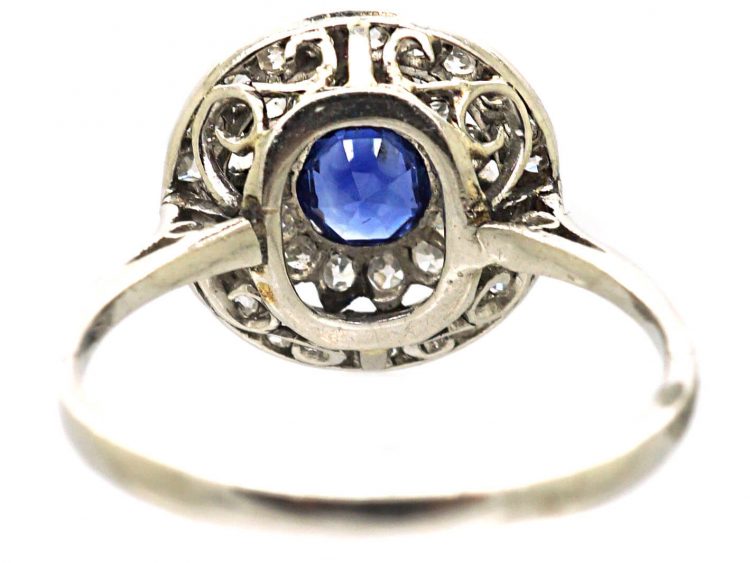 Edwardian Platinum, Sapphire & Diamond Daisy Cluster Ring within a Circle of Diamonds