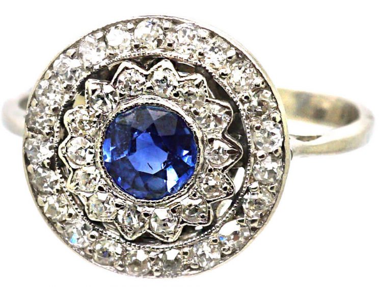 Edwardian Platinum, Sapphire & Diamond Daisy Cluster Ring within a Circle of Diamonds