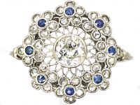 Early 20th Century Platinum, Flower Cluster Ring set with Sapphires & Diamonds