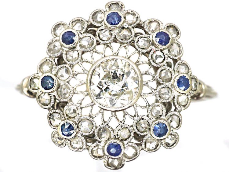 Early 20th Century Platinum, Flower Cluster Ring set with Sapphires & Diamonds