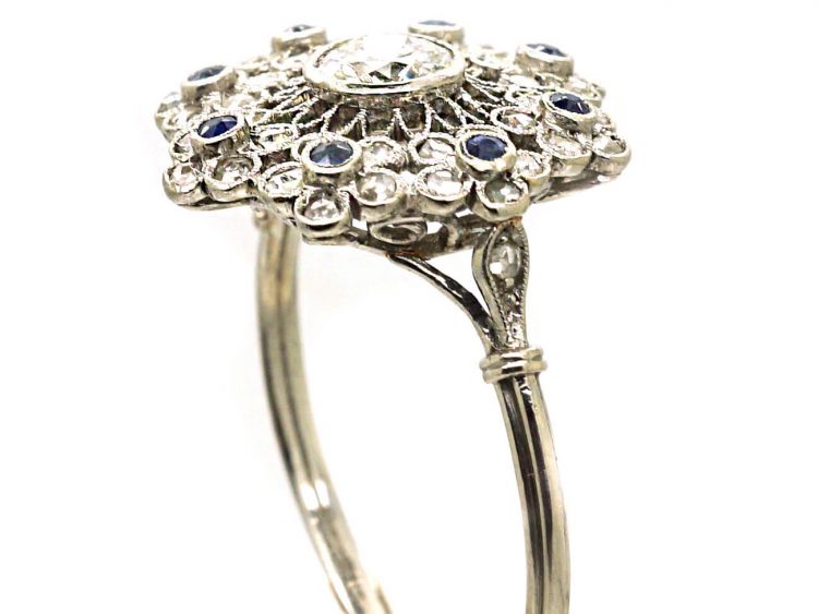 Early 20th Century Platinum, Flower Cluster Ring set with Sapphires & Diamonds