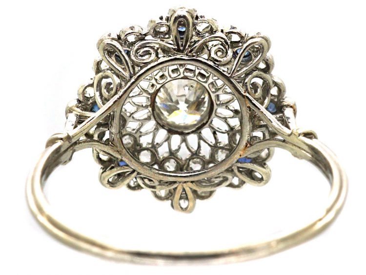 Early 20th Century Platinum, Flower Cluster Ring set with Sapphires & Diamonds