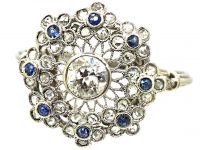 Early 20th Century Platinum, Flower Cluster Ring set with Sapphires & Diamonds