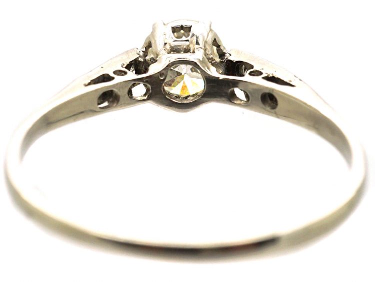 Early 20th Century Platinum Solitaire Diamond Ring with Diamond set Shoulders