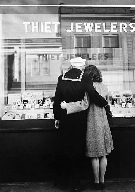 A sailor and his girlfriend look for an engagement ring in the window of a Kenosha, Wisconsin jewellery store