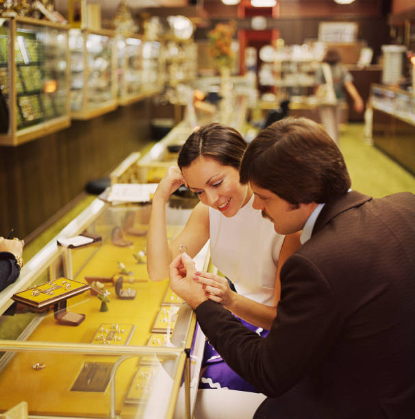 Couple looking at engagement rings in jewelry store