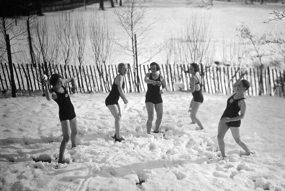 A group of swimmers throw snowballs at each other in Kenwood, London, 1935