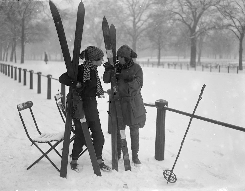 Two sisters smoke before going skiing in London's Hyde Park, January 1926