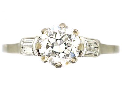 Early 20th Century Platinum, Solitaire Diamond Ring with Baguette Diamond Shoulders