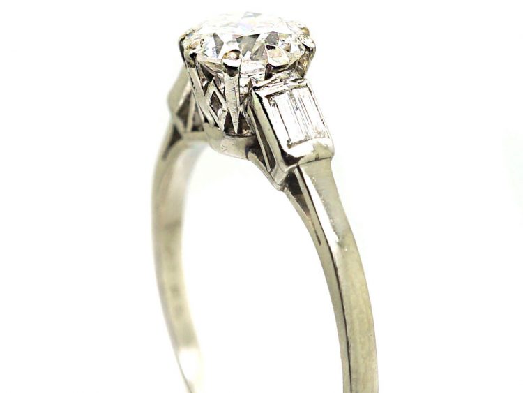 Early 20th Century Platinum, Solitaire Diamond Ring with Baguette Diamond Shoulders