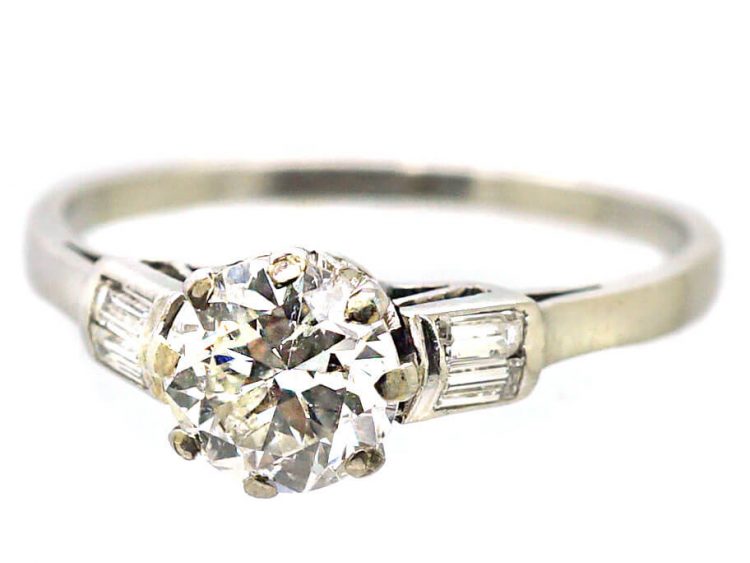 Early 20th Century Platinum, Solitaire Diamond Ring with Baguette Diamond Shoulders