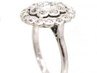 Early 20th Century Platinum, Diamond Daisy Cluster Ring with Outer Ring of Diamonds