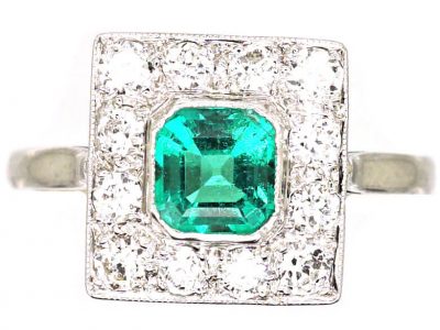 Early 20th Century Platinum Square Ring set with an Emerald & Diamonds