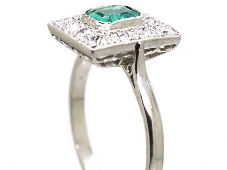 Early 20th Century Platinum Square Ring set with an Emerald & Diamonds