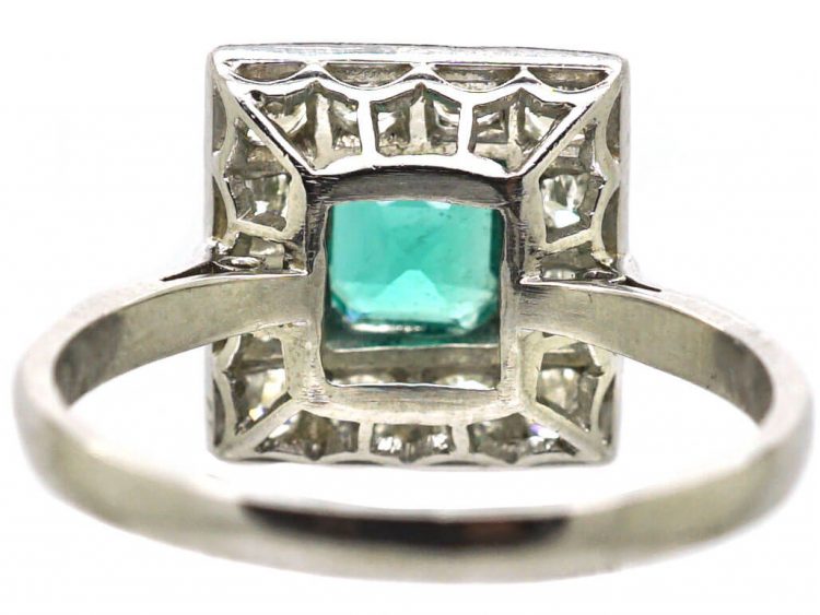 Early 20th Century Platinum Square Ring set with an Emerald & Diamonds