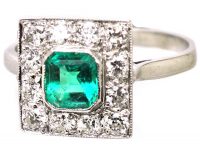 Early 20th Century Platinum Square Ring set with an Emerald & Diamonds