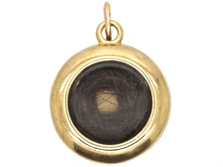 Victorian 15ct Gold Pendant with Locket Back set with an Almandine Garnet