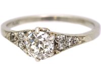 Early 20th Century Platinum, Solitaire Diamond Ring with Diamond set Shoulders