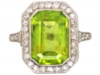 Early 20th Century Platinum Ring set with a Rectangular Cut Peridot & Diamonds