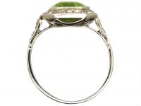 Early 20th Century Platinum Ring set with a Rectangular Cut Peridot & Diamonds