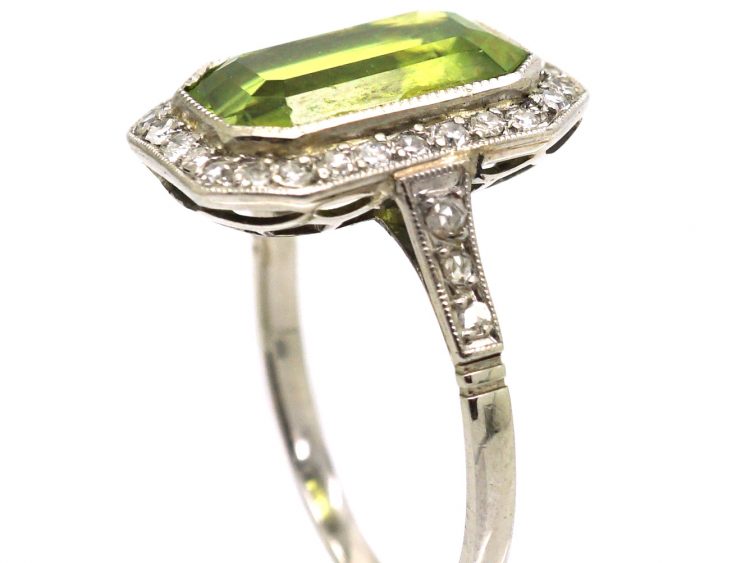 Early 20th Century Platinum Ring set with a Rectangular Cut Peridot & Diamonds