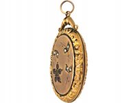 Edwardian 9ct Gold Oval Locket with Flower Motif set with garnets, Peridot & Natural Split Pearls