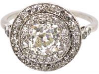 Edwardian Platinum, Diamond Cluster Ring with 1.25 Carat Old Mine Cut Diamond