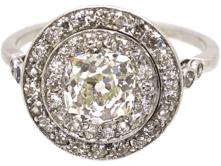 Edwardian Platinum, Diamond Cluster Ring with 1.25 Carat Old Mine Cut Diamond