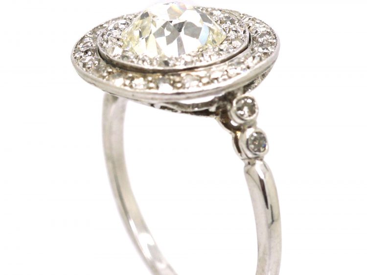 Edwardian Platinum, Diamond Cluster Ring with 1.25 Carat Old Mine Cut Diamond