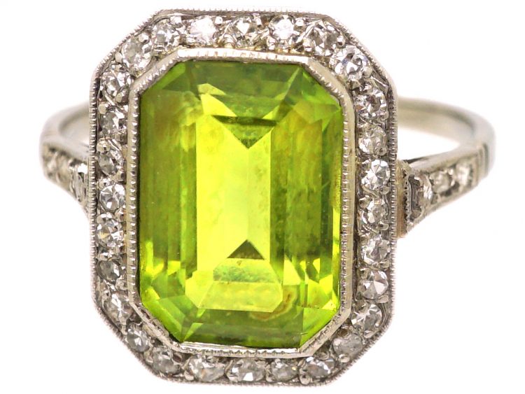 Early 20th Century Platinum Ring set with a Rectangular Cut Peridot & Diamonds