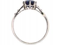 Early 20th Century Platinum Ring set with a Sapphire with Diamond set Shoulders