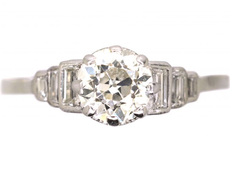 Art Deco Platinum Diamond Solitaire Ring with Step Cut Shoulders set with Baguette Diamonds