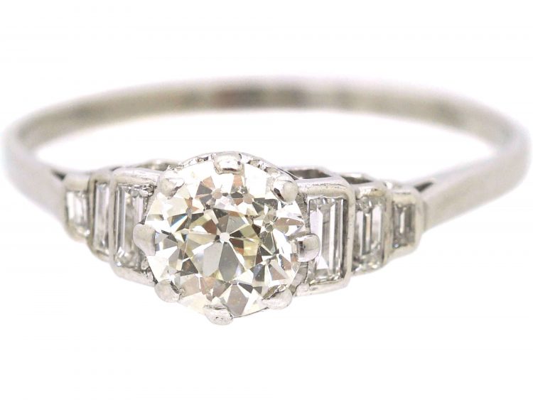 Art Deco Platinum Diamond Solitaire Ring with Step Cut Shoulders set with Baguette Diamonds